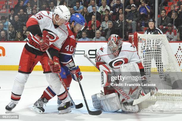 Maxim Lapierre of Montreal Canadiens takes a shot on goalie Cam Ward of the Carolina Hurricanes during the NHL game on March 31, 2010 at the Bell...