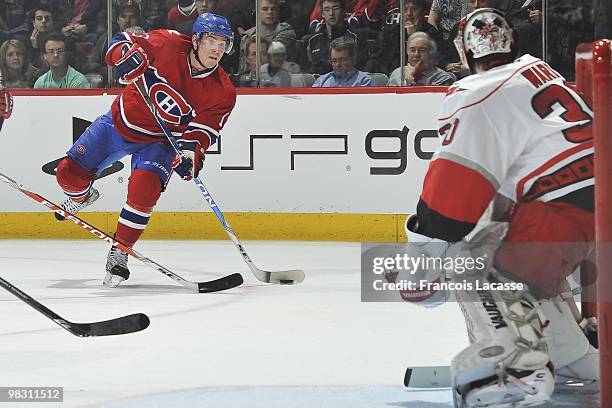 Mike Cammalleri of Montreal Canadiens takes a shot on goalie Cam Ward of the Carolina Hurricanesduring the NHL game on March 31, 2010 at the Bell...