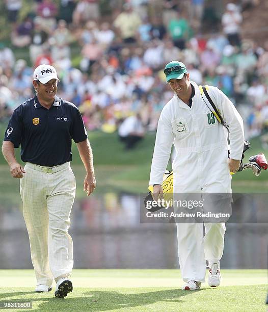 Lee Westwood of England walks with his caddie Michael Vaughn, former England cricket captain, during the Par 3 Contest prior to the 2010 Masters...