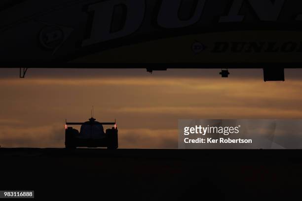 The Algarve Pro Racing Ligier JSP217 of Mark Patterson, Ate De Jong and Tacksung Kim drives under the Dunlop Bridge at dawn during the Le Mans 24...
