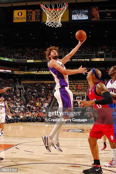 Robin Lopez of the Phoenix Suns lays up a shot against the Los Angeles Clippers during the game on February 26, 2010 at U.S. Airways Center in...