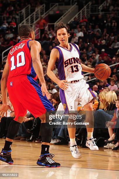 Steve Nash of the Phoenix Suns moves the ball against Eric Gordon of the Los Angeles Clippers during the game on February 26, 2010 at U.S. Airways...