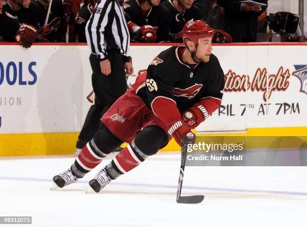 Derek Morris of the Phoenix Coyotes turns the puck up ice against the Edmonton Oilers on April 3, 2010 at Jobing.com Arena in Glendale, Arizona.