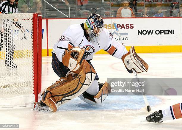 Goaltender Jeff Deslauriers of the Edmonton Oilers makes a stick save against the Phoenix Coyotes on April 3, 2010 at Jobing.com Arena in Glendale,...