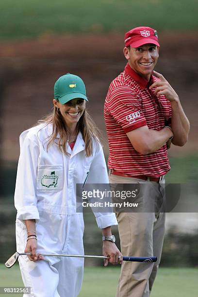 Ricky Barnes smiles at his caddie during the Par 3 Contest prior to the 2010 Masters Tournament at Augusta National Golf Club on April 7, 2010 in...