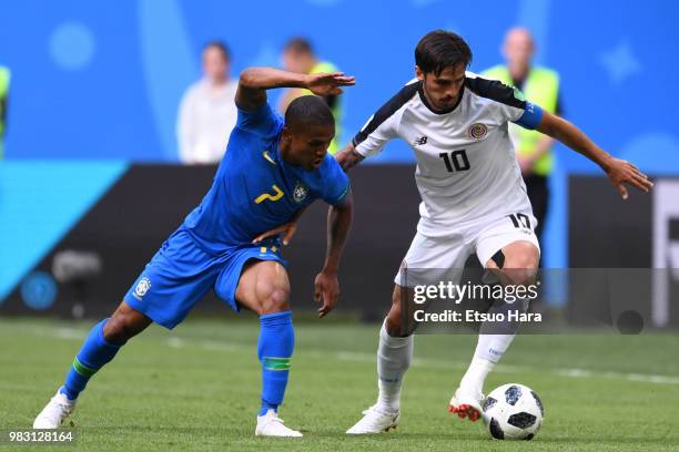 Douglas Costa of Brazil and Bryan Oviedo of Costa Rica compete for the ball during the 2018 FIFA World Cup Russia group E match between Brazil and...