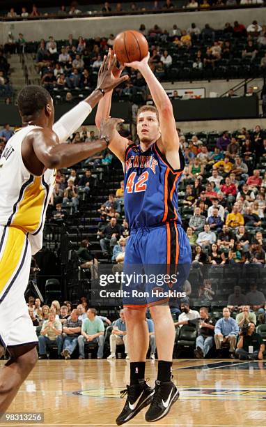 David Lee of the New York Knicks shoots over Roy Hibbert of the Indiana Pacers at Conseco Fieldhouse on April 7, 2010 in Indianapolis, Indiana. NOTE...