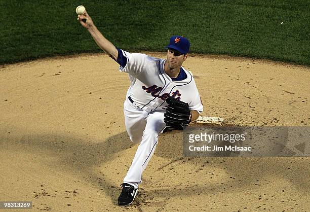 John Maine of the New York Mets delivers a first inning pitch against the Florida Marlins on April 7, 2010 at Citi Field in the Flushing neighborhood...