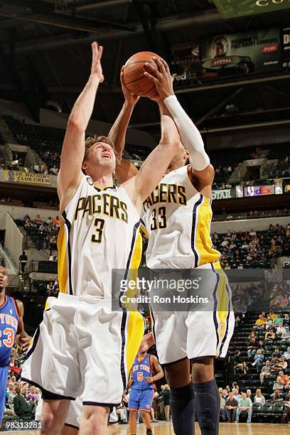 Troy Murphy and Danny Granger of the Indiana Pacers battle for a rebound against the New York Knicks at Conseco Fieldhouse on April 7, 2010 in...