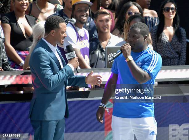 Host Terrence J and Famous Amos speak onstage at Live! Red! Ready! Pre-Show, sponsored by Nissan, at the 2018 BET Awards at Microsoft Theater on June...