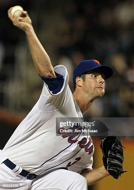 John Maine of the New York Mets delivers a pitch against the Florida Marlins on April 7, 2010 at Citi Field in the Flushing neighborhood of the...