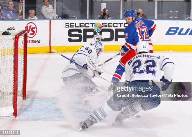 Jonas Gustavsson of the Toronto Maple Leafs protects the net against Olli Jokinen of the New York Rangers in the first period on April 7, 2010 at...