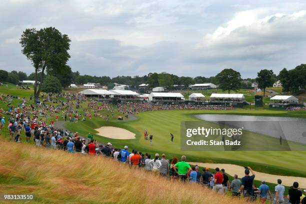 Bubba Watson plays a shot from the 17th fairway during the final round of the Travelers Championship at TPC River Highlands on June 24, 2018 in...