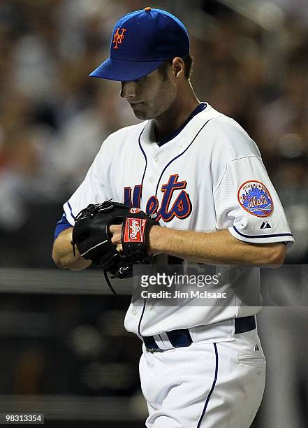 John Maine of the New York Mets walks off the mound after the third inning against the Florida Marlins on April 7, 2010 at Citi Field in the Flushing...
