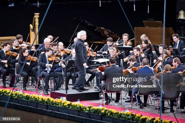 Berliner Philharmoniker with chief conductor Sir Simon Rattle perform live on stage during a concert at the Waldbuehne on June 24, 2018 in Berlin,...