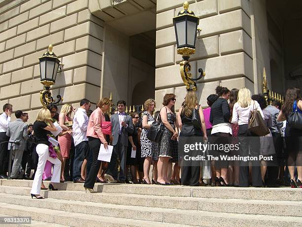 Throngs of invited guests, signed waivers in hand, wait in line to get into the Mellon Auditorium for the taping of a cocktail-party scene for...