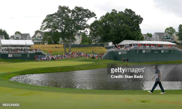 Bubba Watson walks along the 17th fairway during the final round of the Travelers Championship at TPC River Highlands on June 24, 2018 in Cromwell,...