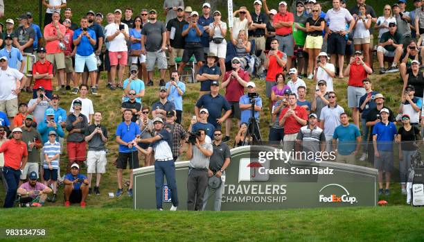 Bubba Watson plays a tee shot on the 17th hole during the final round of the Travelers Championship at TPC River Highlands on June 24, 2018 in...
