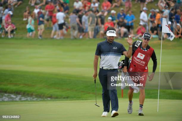 Bubba Watson acknowledges the gallery on the 17th hole during the final round of the Travelers Championship at TPC River Highlands on June 24, 2018...