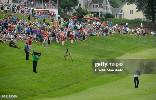 Bubba Watson plays a shot on the 18th fairway during the final round of the Travelers Championship at TPC River Highlands on June 24, 2018 in...