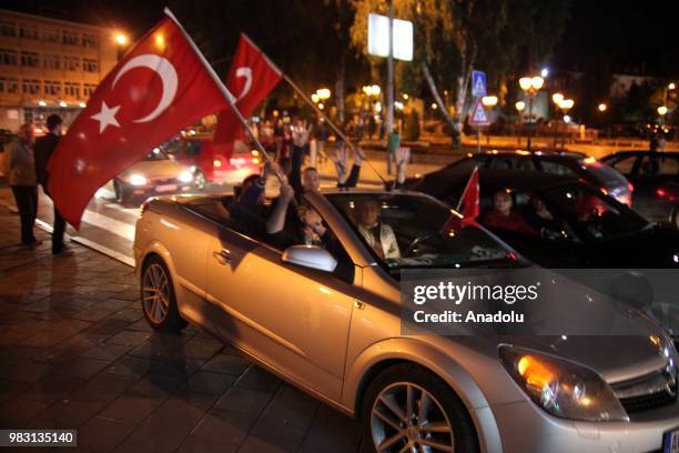 Supporters of Turkish President and the leader of the Justice and Development Party Recep Tayyip Erdogan celebrate as unofficial results show Erdogan...