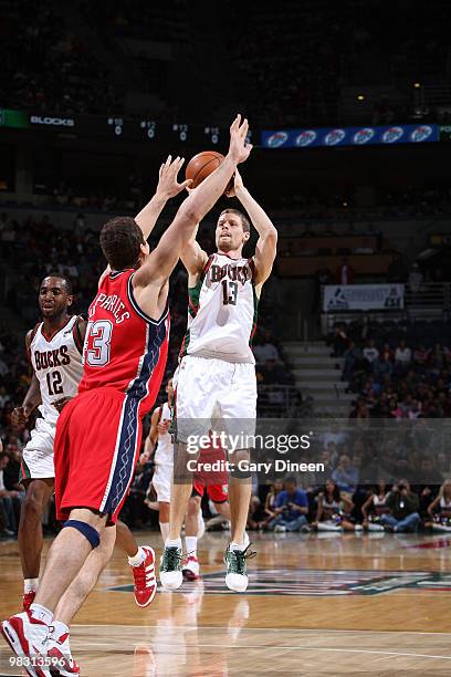 Luke Ridnour of the Milwaukee Bucks shoots a jumpshot against Kris Humphries of the New Jersey Nets on April 7, 2010 at the Bradley Center in...