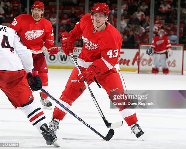 Darren Helm of the Detroit Red Wings takes a shot past Grant Clitsome of the Columbus Blue Jackets during an NHL game at Joe Louis Arena on April 7,...