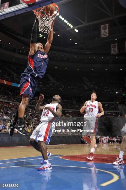 Maurice Evans of the Atlanta Hawks goes up for a dunk past Will Bynum of the Detroit Pistons in a game at the Palace of Auburn Hills on April 7, 2010...