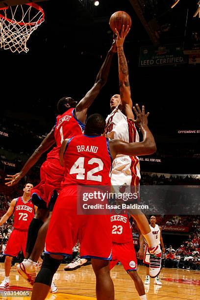 Michael Beasley of the Miami Heat shoots against Samuel Dalembert of the Philadelphia 76ers on April 7, 2010 at American Airlines Arena in Miami,...