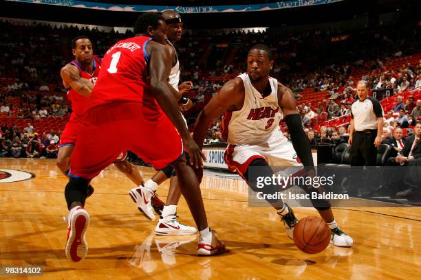 Dwyane Wade of the Miami Heat drives against Samuel Dalembert of the Philadelphia 76ers on April 7, 2010 at American Airlines Arena in Miami,...