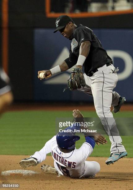Gary Matthews Jr of the New York Mets is forced out at second base in the seventh inning but is able to break up a double play attempt by Hanley...