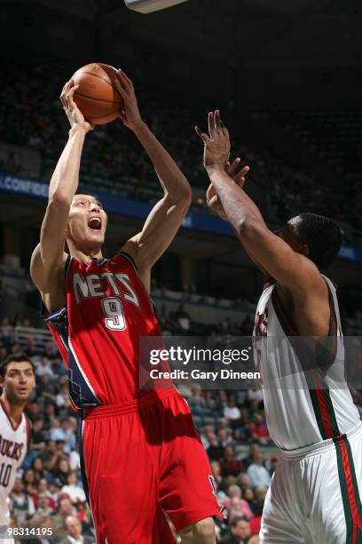 Yi Jianlian of the New Jersey Nets draws a foul against Kurt Thomas of the Milwaukee Bucks on April 7, 2010 at the Bradley Center in Milwaukee,...