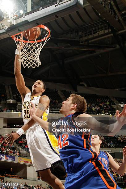 Brandon Rush of the Indiana Pacers lays the ball up over David Lee of the New York Knicks at Conseco Fieldhouse on April 7, 2010 in Indianapolis,...