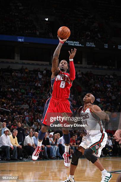 Terrence Williams of the New Jersey Nets shoots a jumpshot against Jerry Stackhouse of the Milwaukee Bucks on April 7, 2010 at the Bradley Center in...