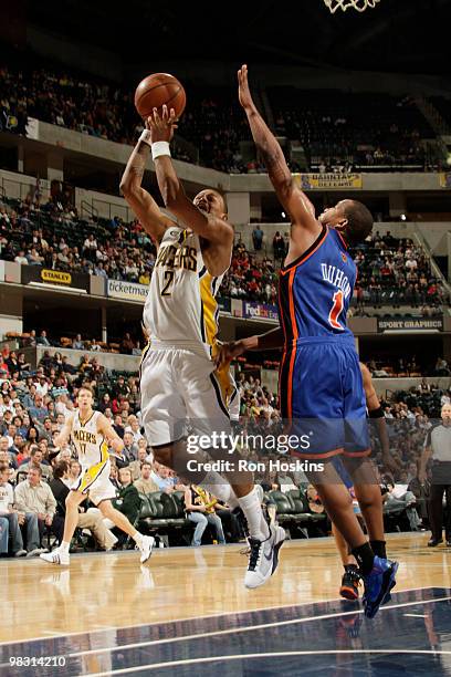 Earl Watson of the Indiana Pacers shoots over Chris Duhon of the New York Knicks at Conseco Fieldhouse on April 7, 2010 in Indianapolis, Indiana. The...