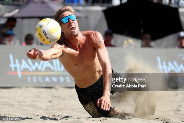 Taylor Crabb dives for the ball while competing against Phil Dalhausser and Nick Lucena during the Men's Championship game of the AVP Seattle Open at...