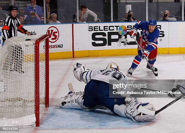 Olli Jokinen of the New York Rangers scores a goal against goaltender Jonas Gustavsson of the Toronto Maple Leafs in the third period on April 7,...