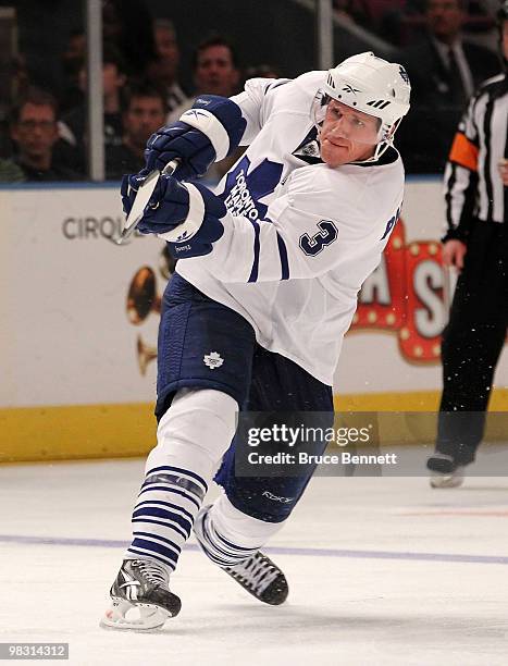 Dion Phaneuf of the Toronto Maple Leafs scores his first goal as a Leaf in his game against the New York Rangers at Madison Square Garden on April 7,...