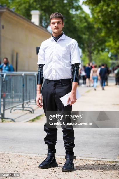 Guido Milani, wearing white shirt and black pants, is seen in the streets of Paris before the Balmain show, during Paris Men's Fashion Week...