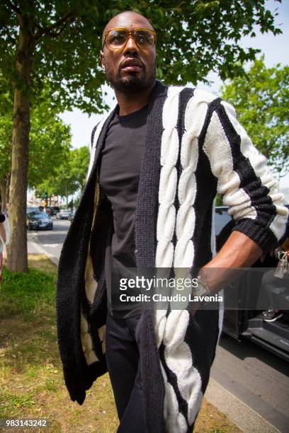 Serge Ibaka, wearing black t shirt, black pants and black and white coat, is seen in the streets of Paris before the Balmain show, during Paris Men's...