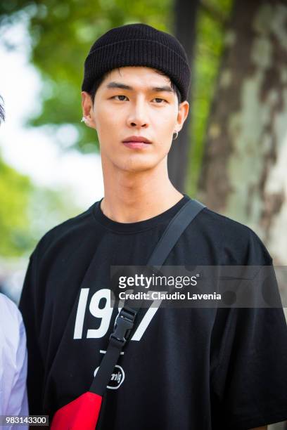 Guest, wearing black hat and black sweater, is seen in the streets of Paris after the Balmain show, during Paris Men's Fashion Week Spring/Summer...