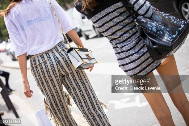Fashion detail of Model Pauline Hoarau, Balmain bag, is seen in the streets of Paris after the Balmain show, during Paris Men's Fashion Week...