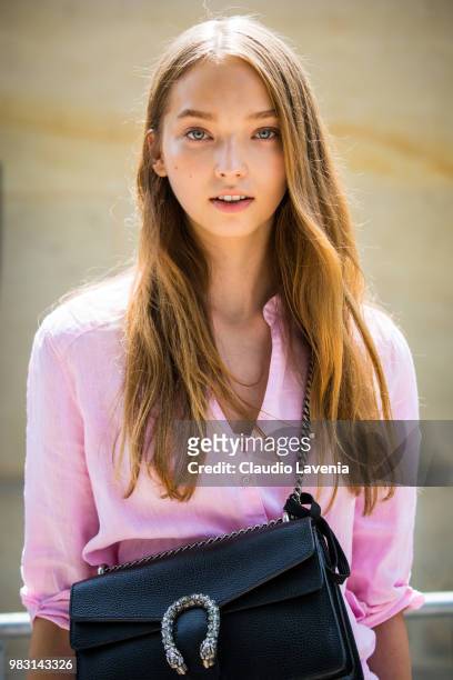 Model Milena Ioanna, wearing pink shirt and Gucci black bag, is seen in the streets of Paris after the Balmain show, during Paris Men's Fashion Week...