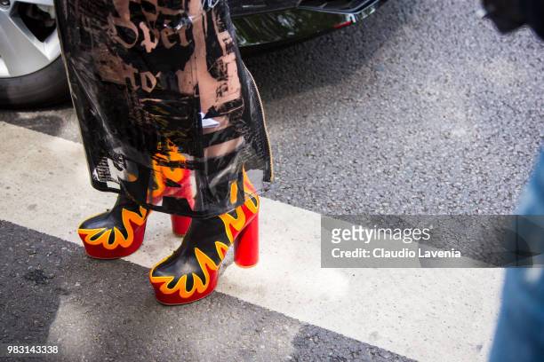 Fashion detail of heels boots whit flames, is seen in the streets of Paris before the Balmain show, during Paris Men's Fashion Week Spring/Summer...