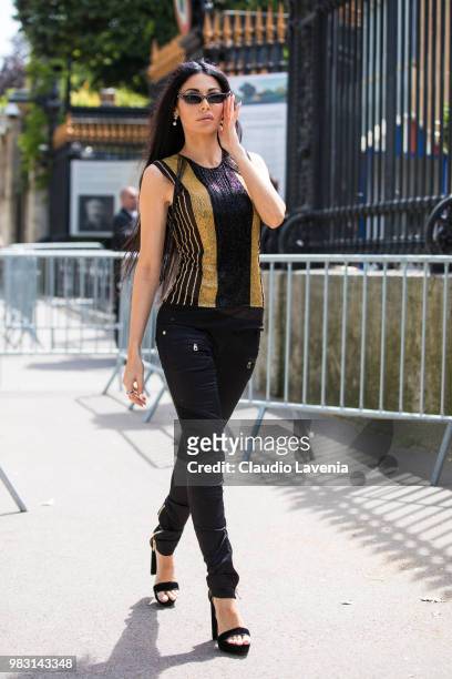 Alessandra Sorcinelli , wearing gold and black t shirt, Balmain jacket and Chanel bag, is seen in the streets of Paris before the Balmain show,...