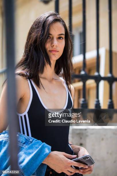 Model, wearing Adidas black and white top, is seen in the streets of Paris after the Balmain show, during Paris Men's Fashion Week Spring/Summer 2019...