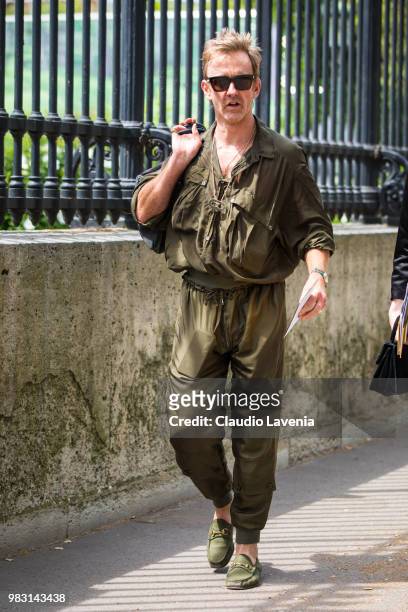 Tom Stubbs, wearing green shirt and green pants, is seen in the streets of Paris before the Balmain show, during Paris Men's Fashion Week...