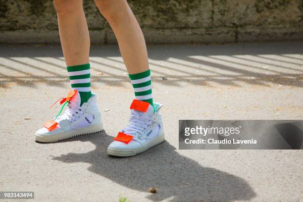Fashion detail of Off White sneakers, is seen in the streets of Paris before the Balmain show, during Paris Men's Fashion Week Spring/Summer 2019 on...