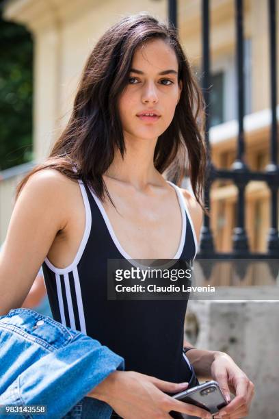 Model, wearing Adidas black and white top, is seen in the streets of Paris after the Balmain show, during Paris Men's Fashion Week Spring/Summer 2019...