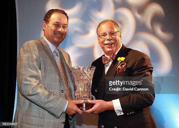 Loren Roberts of the USA receives the Senior Player of the Year award from Alex Miceli of Golf Week during the 2010 Golf Writers of America Annual...